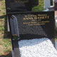 Computer cut inscription and design work on Dark grey granite Computer cut inscription and design work on Dark grey granite